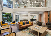 Thumbnail 17 of 31 - A modern living room with a glass ceiling and a large window.