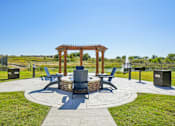 Thumbnail 30 of 43 - A gazebo sits in the middle of a circular walkway with benches on either side.