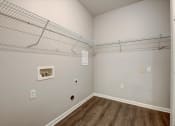 Thumbnail 19 of 48 - a bedroom with a closet and a wire shelving unit