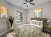 Thumbnail 19 of 52 - a bedroom with a large bed and a ceiling fan