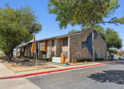 Thumbnail 18 of 19 - a building with a flag in front of it