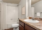 Thumbnail 7 of 28 - a bathroom with a bathtub and a sink