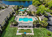 Thumbnail 35 of 42 - an aerial view of a house with an outdoor pool and a swimming pool and house