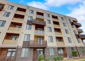 Thumbnail 47 of 50 - a large apartment building with balconies on the side of it