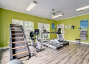 Thumbnail 26 of 44 - the gym with treadmills and weights at the commons on 54th