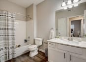 Thumbnail 14 of 48 - a bathroom with a bathtub toilet and sink