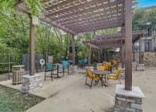 Thumbnail 44 of 50 - a patio with tables and chairs and a pergola