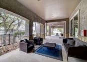 Thumbnail 38 of 42 - a large patio with furniture and a pool in the background