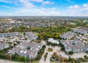 Thumbnail 48 of 50 - an aerial view of a neighborhood with houses and trees
