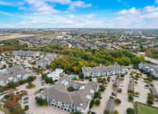 Thumbnail 49 of 50 - an aerial view of a neighborhood with houses and trees