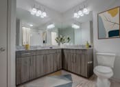 Thumbnail 9 of 52 - a bathroom with a toilet and a large mirror
