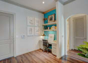 Thumbnail 17 of 52 - a home office with a desk and a chair