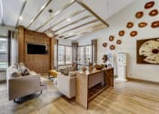 Thumbnail 19 of 27 - a living room with couches and a dining room table