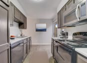 Thumbnail 3 of 23 - a kitchen with stainless steel appliances and stainless steel cabinets and a stainless steel stove top