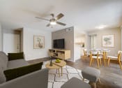 Thumbnail 1 of 27 - a living room with a ceiling fan and a dining room table