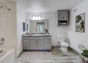 Thumbnail 7 of 44 - a bathroom with a sink toilet and a bath tub