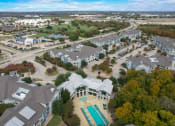 Thumbnail 50 of 50 - an aerial view of a neighborhood with houses and a swimming pool