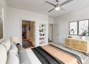Thumbnail 6 of 44 - a bedroom with a bed and a ceiling fan