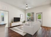 Thumbnail 1 of 28 - an open living room with a couch and a tv