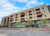 Thumbnail 46 of 50 - a large building with a street in front of it