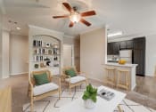 Thumbnail 2 of 42 - a living room and kitchen with a ceiling fan