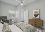 Thumbnail 5 of 28 - a bedroom with a large bed and a ceiling fan