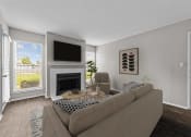 Thumbnail 2 of 29 - the living room of an apartment with a couch and a fireplace