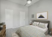 Thumbnail 6 of 28 - a bedroom with a large bed and a ceiling fan