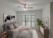 Thumbnail 10 of 52 - a bedroom with a large bed and a ceiling fan