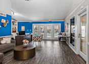 Thumbnail 19 of 37 - a living room with blue walls and a patio door