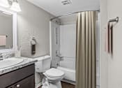 Thumbnail 8 of 37 - a bathroom with a shower toilet and a sink