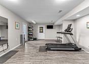 Thumbnail 21 of 37 - our community gym is equipped with cardio equipment and a treadmill