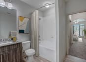 Thumbnail 12 of 52 - a bathroom with a shower and a toilet and a sink