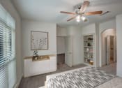 Thumbnail 8 of 52 - a bedroom with a bed and a ceiling fan