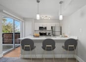 Thumbnail 4 of 41 - the preserve at ballantyne commons apartment kitchen and breakfast bar with stools