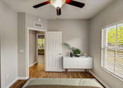 Thumbnail 7 of 34 - an empty bedroom with a ceiling fan and a white dresser