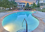 Thumbnail 18 of 22 - A small pool with a ladder in the middle of it.