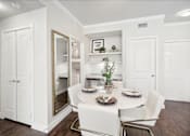 Thumbnail 13 of 33 - a dining room with a white table and chairs