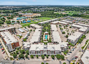 Thumbnail 33 of 33 - an aerial view of a city with buildings and a pool