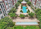 Thumbnail 2 of 33 - an aerial view of the pool and courtyard of an apartment building