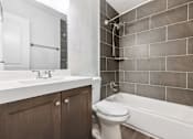 Thumbnail 20 of 79 - a bathroom with a sink toilet and bath tub