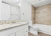 Thumbnail 18 of 79 - a bathroom with a toilet and a tub and a sink