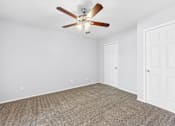 Thumbnail 17 of 79 - an empty living room with a ceiling fan