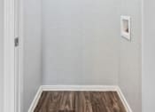 Thumbnail 21 of 79 - room with white walls and wood flooring and a white door
