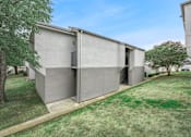 Thumbnail 66 of 79 - a modern house with a lawn and trees