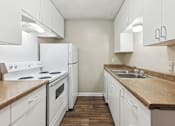 Thumbnail 30 of 79 - a kitchen with white appliances and white cabinets