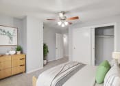 Thumbnail 7 of 23 - a bedroom with a bed and a ceiling fan