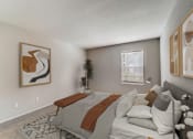 Thumbnail 6 of 27 - the living room of an apartment with a couch and a bed