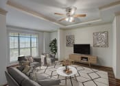 Thumbnail 2 of 52 - a living room with a ceiling fan and a television