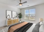 Thumbnail 5 of 44 - a bedroom with a large bed and a ceiling fan
